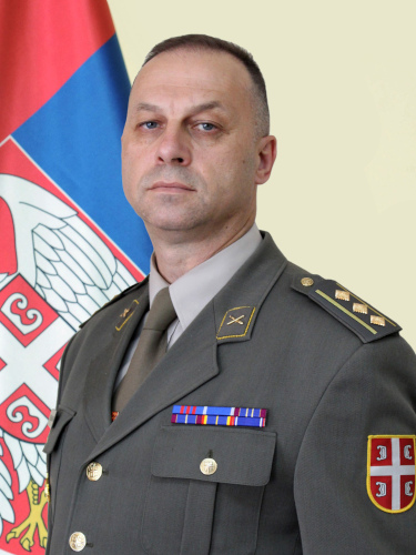 Полковник Небоjша Недељковиħ. Эмблемы артиллерии