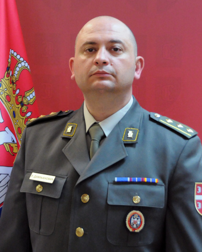 Полковник Радован Дамњановиħ. Эмблемы финансовой
службы